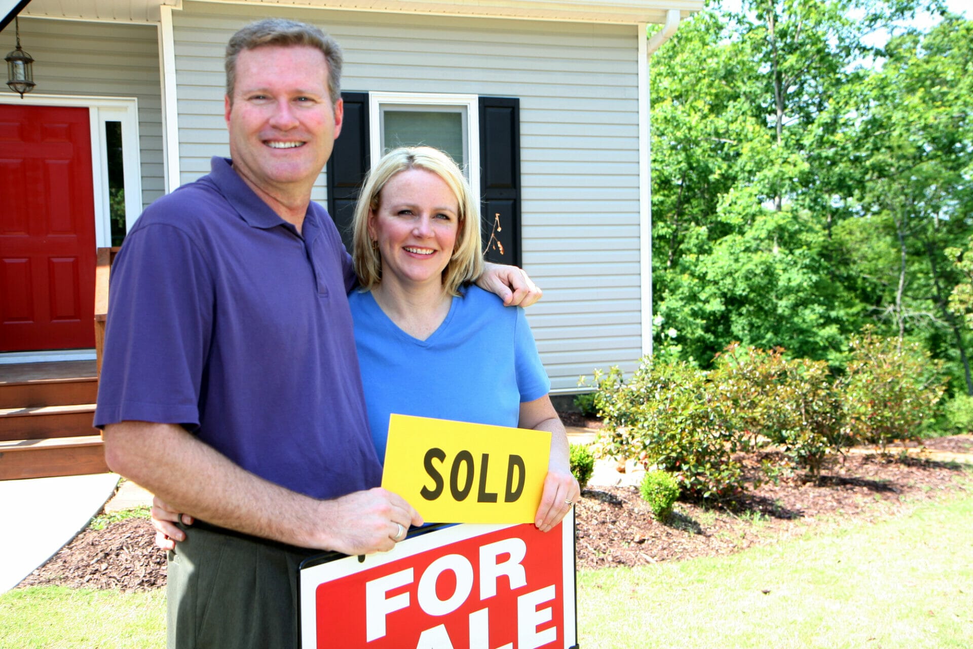 happy couple selling their home