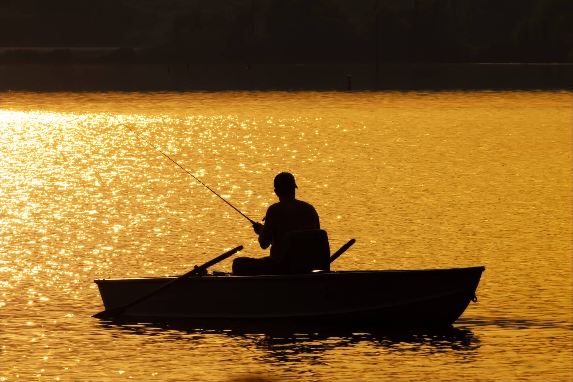 hobbies after downsizing, man in fishing boat