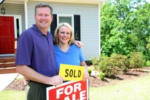happy couple selling their home